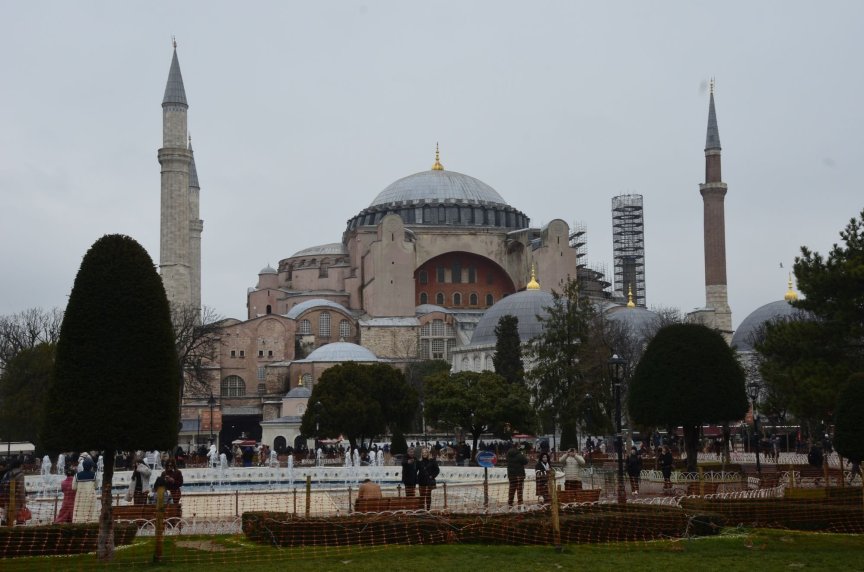 Discover the iconic Hagia Sophia in Istanbul with crowds in the foreground.