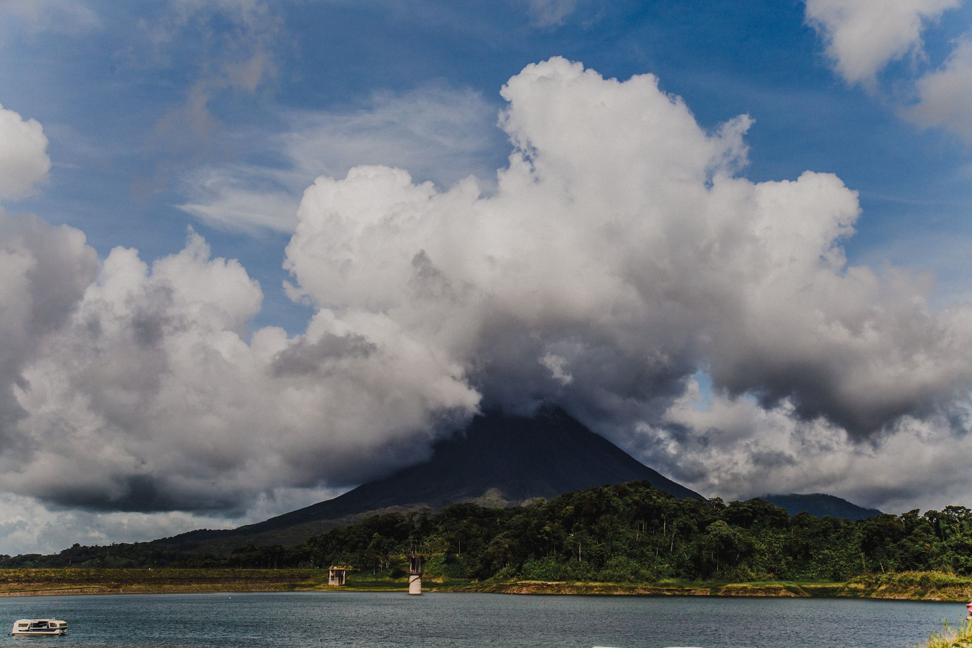 Arenal Volcano in Costa Rica with clouds over the lake
