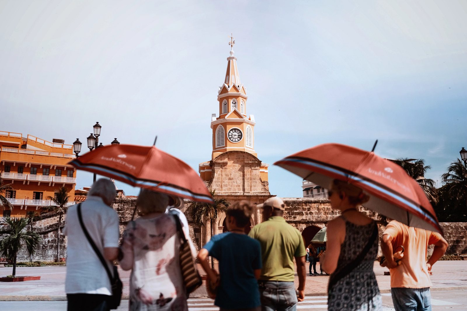 Travelers at Cartagena's Clock Tower Gate