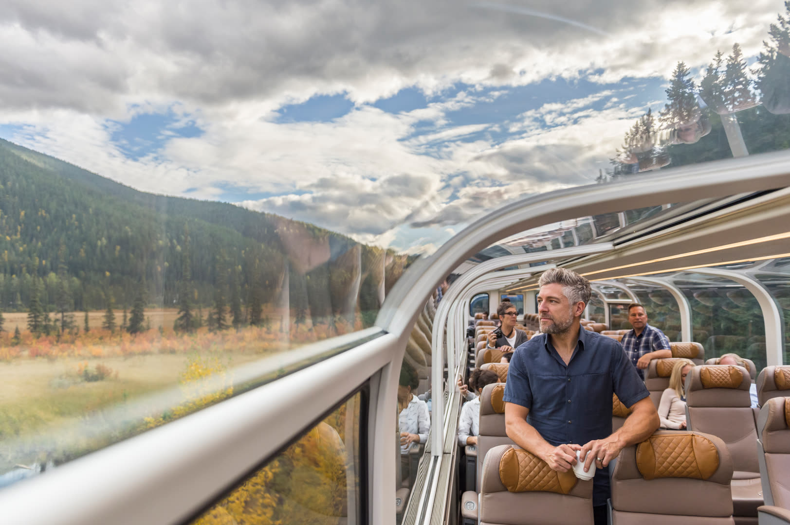Rocky Mountaineer GoldLeaf Service glass dome interior with panoramic mountain views