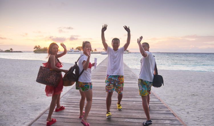 group of friends on beautiful beach