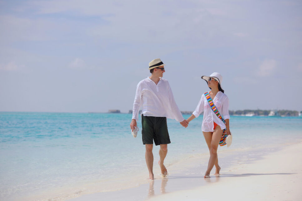 happy young couple have fun on beach