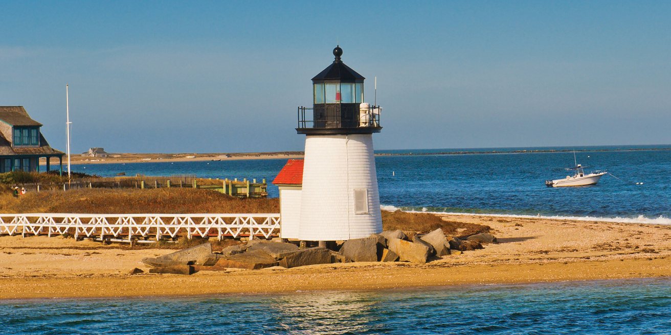 The white lighthouse at the entrance to Nantucket Harbor