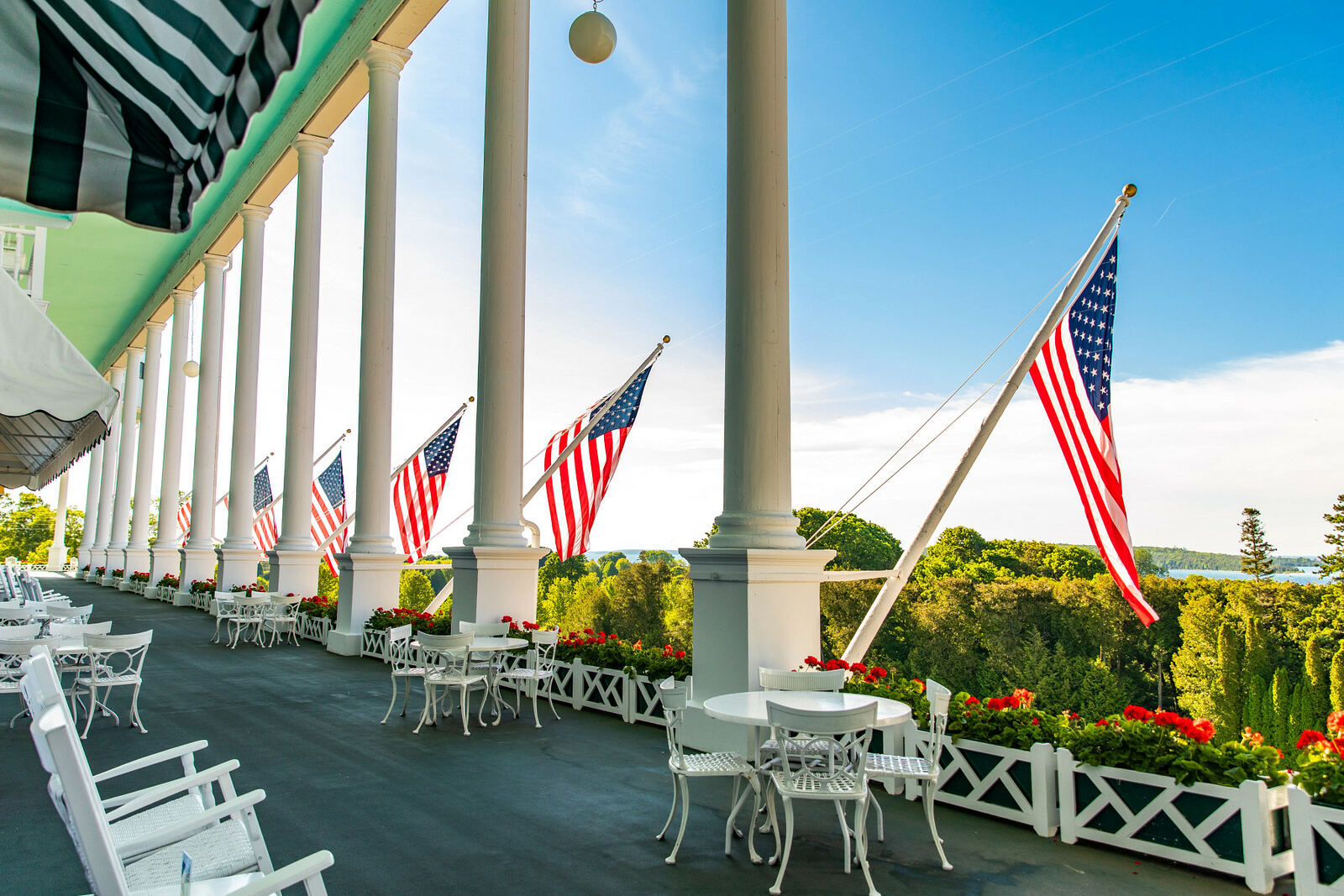Rocking chairs and American flags along the Grand Hotel porch