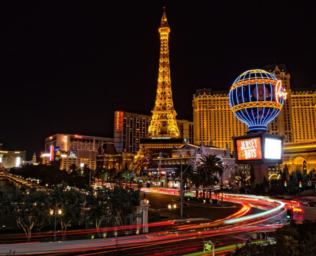 a busy street in Las Vegas at night with blurry lines from car lights